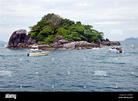 Divers Exploring Marine Nature On Koh Chang Island With Tour Boat In Divers Exploring Marine Nature On Koh Chang Island With Tour Boat In